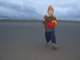 Dragging the kite down the beach